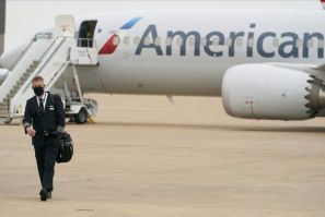 American Airlines expects to fly at least 45 percent less in the first quarter of 2021 and no longer expects to be at full capacity this summer as expectations for a recovery in travel are delayed by the slow rollout of coronavirus vaccines