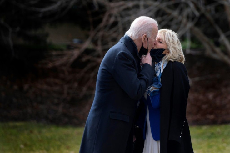 US President Joe Biden kisses First Lady Jill Biden at the White House