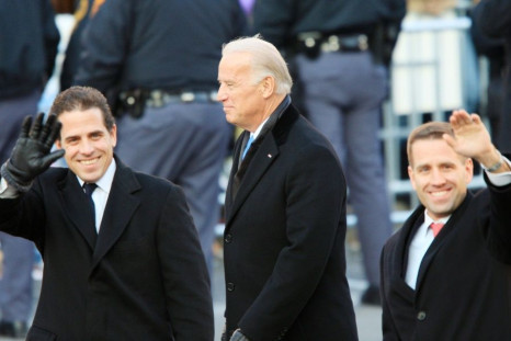 Then Vice-President Joe Biden (C) and sons Hunter Biden (L) and Beau Biden walk in then-President Barack Obama's Inaugural Parade January 20, 2009 in Washington, DC