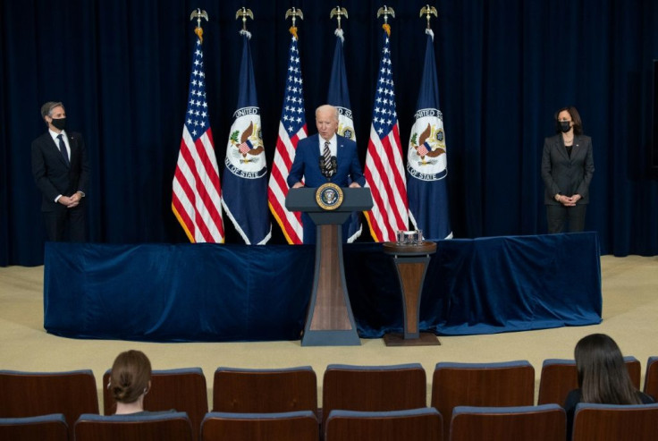 US President Joe Biden, with Secretary of State Antony Blinken and Vice President Kamala Harris, speaks to the staff of the US State Department