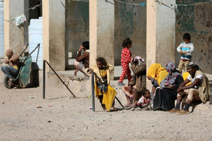 Displaced Yemenis who fled fighting between Huthi rebels and the Saudi-backed government forces stay inside a school building in the town of al-Turba in Taez governerate