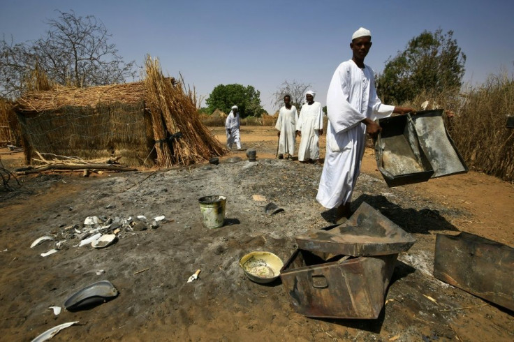 Villagers inspect the aftermath of the attack in Twail Saadoun