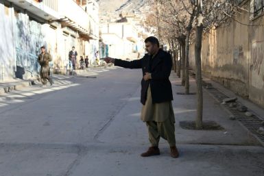 Abdul Baqi Rasheed points to the spot where his brother, the activist Mohammad Yousuf Rasheed, was shot dead in Kabul