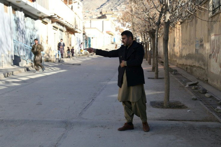 Abdul Baqi Rasheed points to the spot where his brother, the activist Mohammad Yousuf Rasheed, was shot dead in Kabul