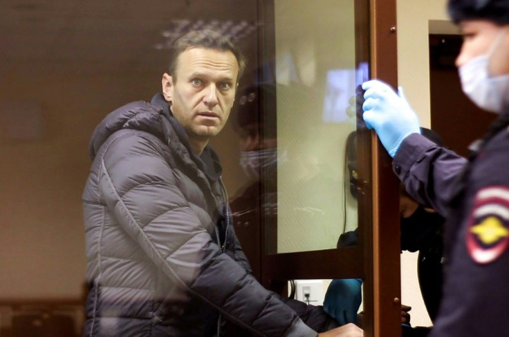 Alexei Navalny, jailed earlier in the week, attended court to face another charge of defamation