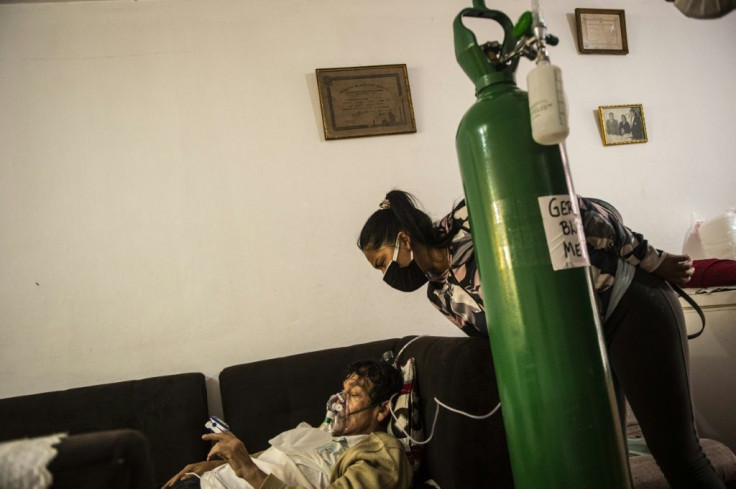 July Blanco was one of hundreds who queued for a refill outside the Criogas factory in Peru, bringing relief for her ailing father German