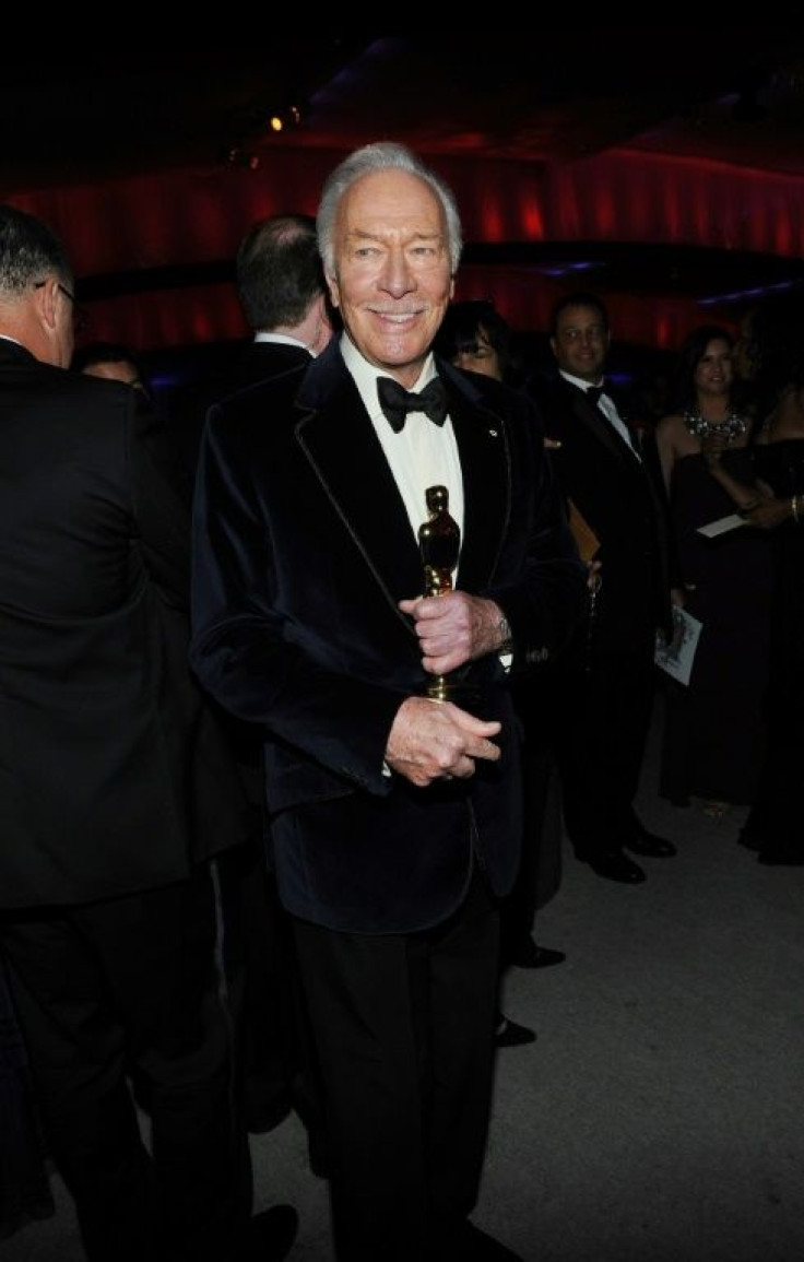 Christopher Plummer holds his Oscar for best supporting actor in "Beginners" after the awards ceremony in 2012