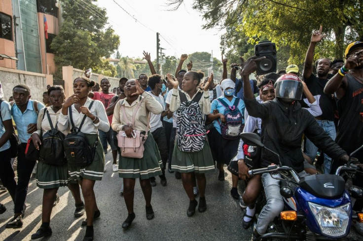 Students march through the Haitian capital Port-au-Prince on January 25, 2021 after the kidnapping of an elementary school student