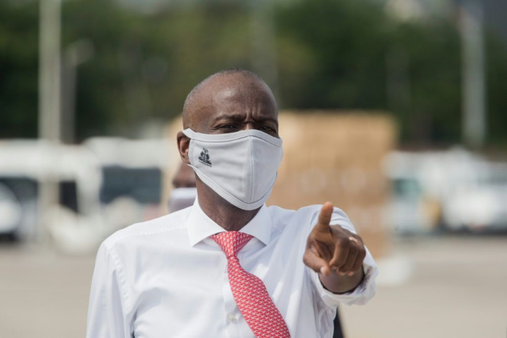 Haitian President Jovenel Moise, seen instructing staff at the instructs staff members at the Port-au-Prince airport in May 2020, controversially says he is entitled to another year in office