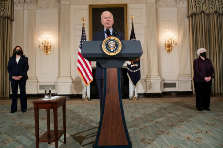 US Vice President Kamala Harris (L) and US Secretary of the Treasury Janet Yellen (R) listen while US President Joe Biden speaks about COVID-19 relief at the White House