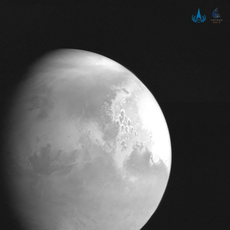 China's space probe has sent back its first image of Mars and is scheduled to touch down on the Red Planet later this year