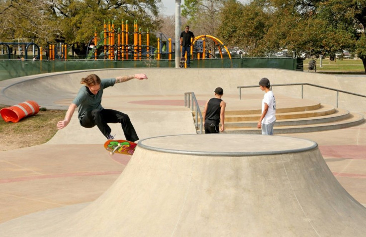 Skateboarder Dallis Thompson ( center background) watches the action while awaiting his turn at a skate park in Houston, Texas, on January 26, 2021