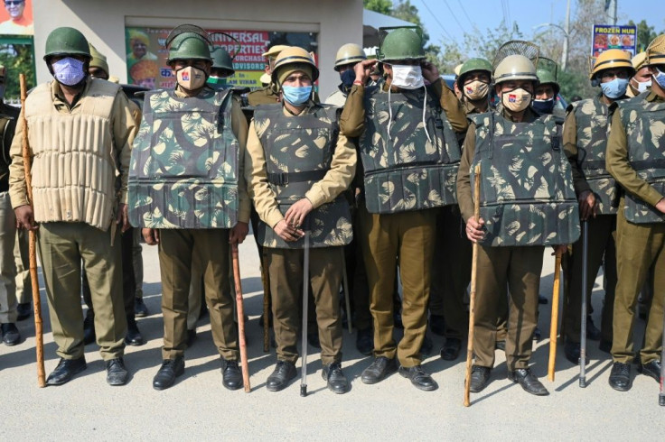 Police stood guard at a roadblock in Gurgaon, near New Delhi