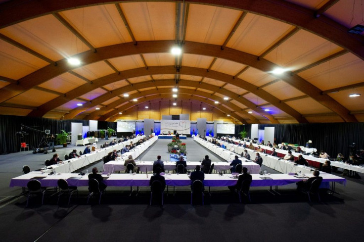 Delegates attending a vote for the new interim government during a meeting of the Libyan Political Dialogue Forum near Geneva