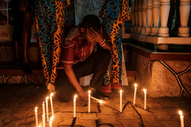 Members of the LGBTIQ community light candles as they take part in a vigil for the Transgender Day of Remembrance to remember victims of hate crimes in Kampala, Uganda in November 2019