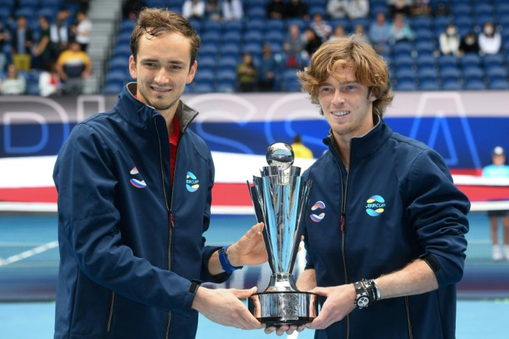 Russia's Daniil Medvedev (left) and Andrey Rublev lift the ATP Cup after beating Italy in the final