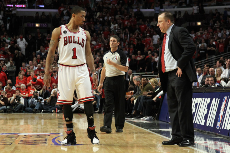 Derrick Rose #1 of the Chicago Bulls talks with head coach Tom Thibodeau