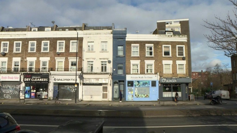 Blink and you could easily miss it. Wedged between a doctor's surgery and a hairdressing salon, London's thinnest house is only identified by a streak of dark blue paint. But the five-floor house in Shepherd's Bush -- which is just 5ft 6ins (1.6 metres) a