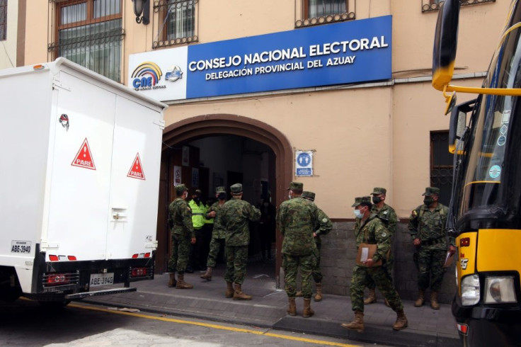 Ecuadorian soldiers carry electoral materials for the upcoming general election at the National Electoral Council of Azuay, in Cuenca, Ecuador