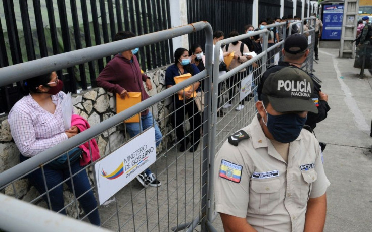 People who will work in polling stations wait for electoral material for Ecuador's upcoming election at the National Electoral Council's headquarters in Guayaquil, Ecuador on February 5, 2021