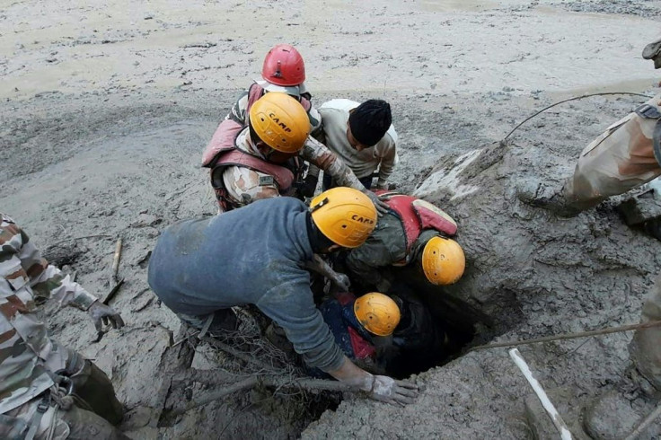Rescuers at work after a broken glacier caused a river surge that swept away bridges and roads in the Chamoli district of Uttarakhand, northern India