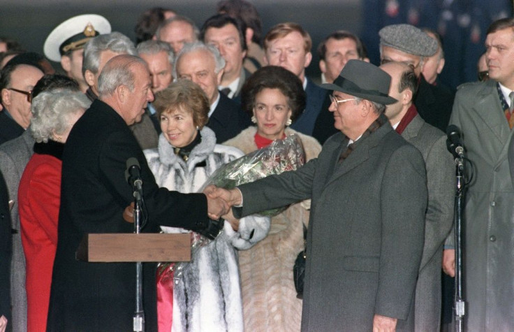 Soviet leader Mikhail Gorbachev (right) and his wife Raisa are greeted by US Secretary of State George Shultz upon their arrival in the United States on December 7, 1987
