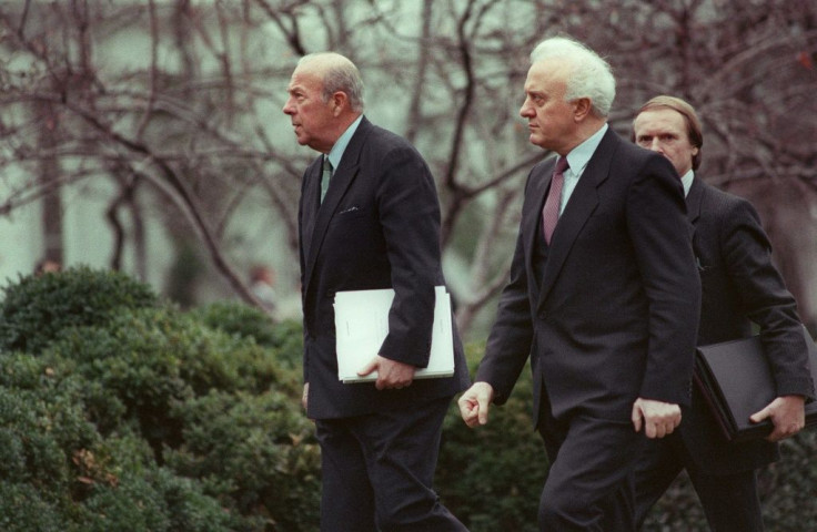 George Shultz, then the US secretary of state, walks into the White House with Soviet Foreign Minister Eduard Shevardnadze in December 1987
