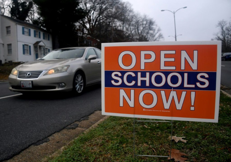 A sign calling for schools to reopen in Arlington, Virginia, pictured in December 2020