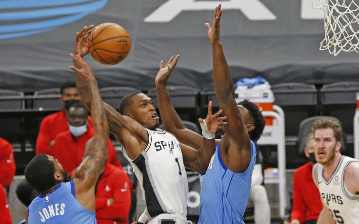 Lonnie Walker #1 of the San Antonio Spurs drives to the basket against the Houston Rockets 