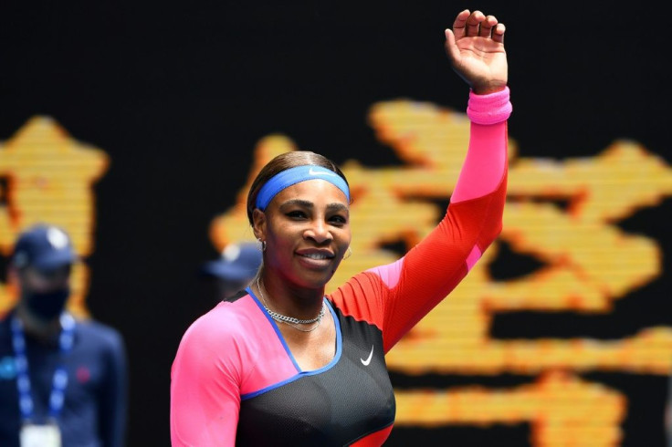 Serena Williams of the US celebrates after winning against Germany's Laura Siegemund during their women's singles match on day one of the Australian Open tennis tournament in Melbourne on Monday