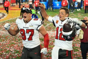 Rob Gronkowski #87 and Tom Brady #12 of the Tampa Bay Buccaneers celebrate winning Super Bowl LV 