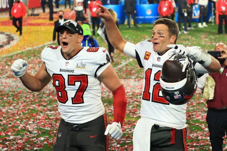 Rob Gronkowski #87 and Tom Brady #12 of the Tampa Bay Buccaneers celebrate winning Super Bowl LV 