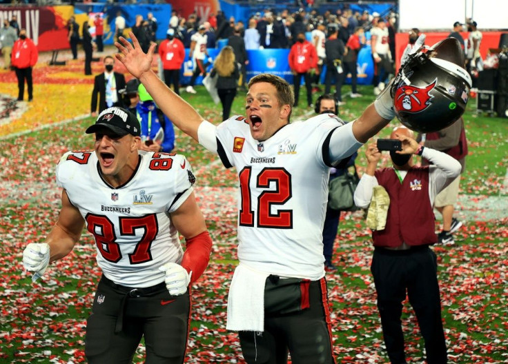 Tom Brady celebrates with team-mate Rob Gronkowski after Sunday's Super Bowl win