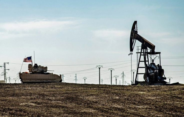 A US Bradley Fighting Vehicle patrols near oil production facilities in Syria's northeastern Hasakah province in early February.