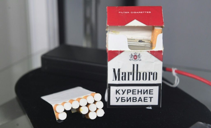 A Russian spy cigarette pack with hidden camera is displayed during an auction preview for "The Cold War Relics Auction" at Julien's Auctions in Beverly Hills, California