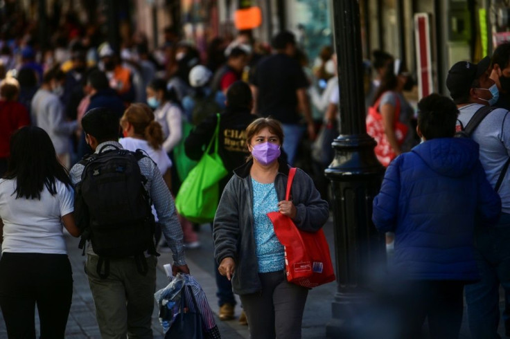 Crowds still gather in the streets and on public transport in Mexico City despite an official halt to most non-essential activities