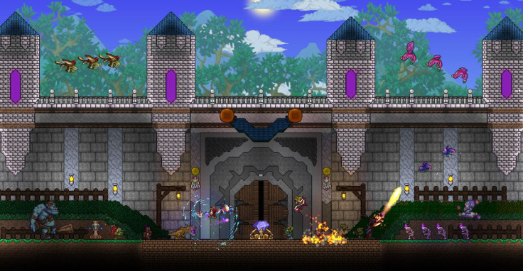 Players fending off a wave of monsters in Terraria