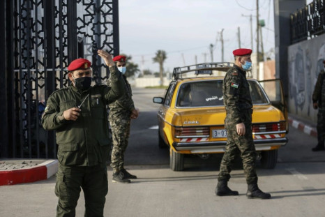 Palestinian security forces loyal to Hamas stand guard at the Rafah border crossing with Egypt