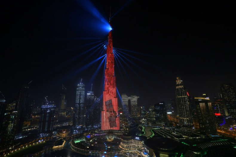Dubai's Burj Khalifa is lit up in red on February 9, 2021 as the UAE's "Al-Amal" -- Arabic for "Hope" -- probe to Mars carries out a tricky manoeuvre to enter the Red Planet's orbit
