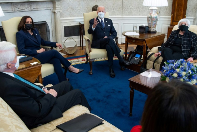 US President Joe Biden sits alongside US Vice President Kamala Harris (2nd L) and Treasury Secretary Janet Yellen (R) as he holds a meeting with business leaders about a Covid relief bill