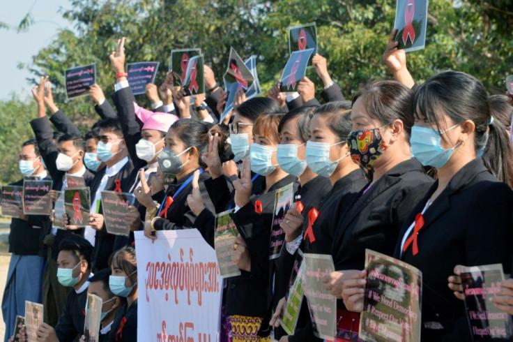 Medical staff, air traffic controllers and teachers have staged strikes, fronted for work while wearing red ribbons on their uniforms or posed for photos while brandishing the three-finger salute adopted by the anti-coup movement