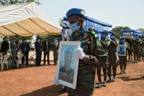 MINUSMA troops carry the coffins of four Ivorian comrades who were killed by a roadside bomb in northwestern Mali on January 13