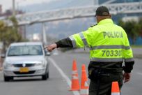 Colombian police stop vehicles in Bogota on February 10, 2021 following a report that ELN rebels planned to attack the city in the "next few days"