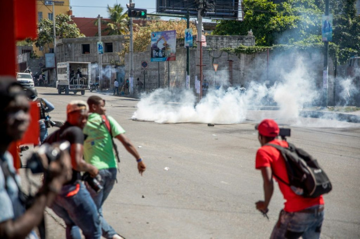 Tear gas is fired by police during a march in Port-au-Prince on February 10, 2021, to protest against the government of President Jovenel Moise