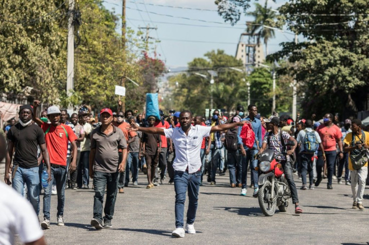 Demonstrators march in Port-au-Prince on February 10, 2021, to protest against the government of President Jovenel Moise