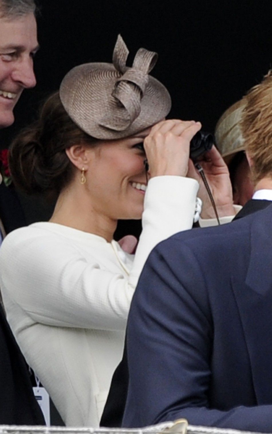 Catherine, Britain039s Duchess of Cambridge looks through binoculars as she attends Epsom Derby horse race at Epsom Racecourse in southern England