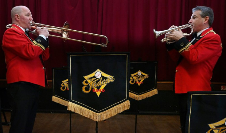 Cornet player Mark Wilkinson (R) and solo trombonist John Barber of Foden's Brass Band, which dates back to 1900