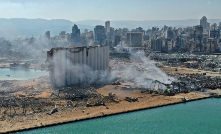 Beirut's port was left devastated by a massive blast on August 4, 2020, here photographed one day after the explosion, including damaging containers of chemicals which are now being cleared