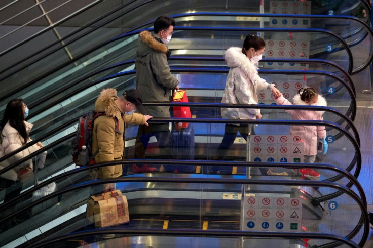 As China offers a slew of financial incentives to workers who stay put, railway stations in Beijing and elsewhere are emptier than usual