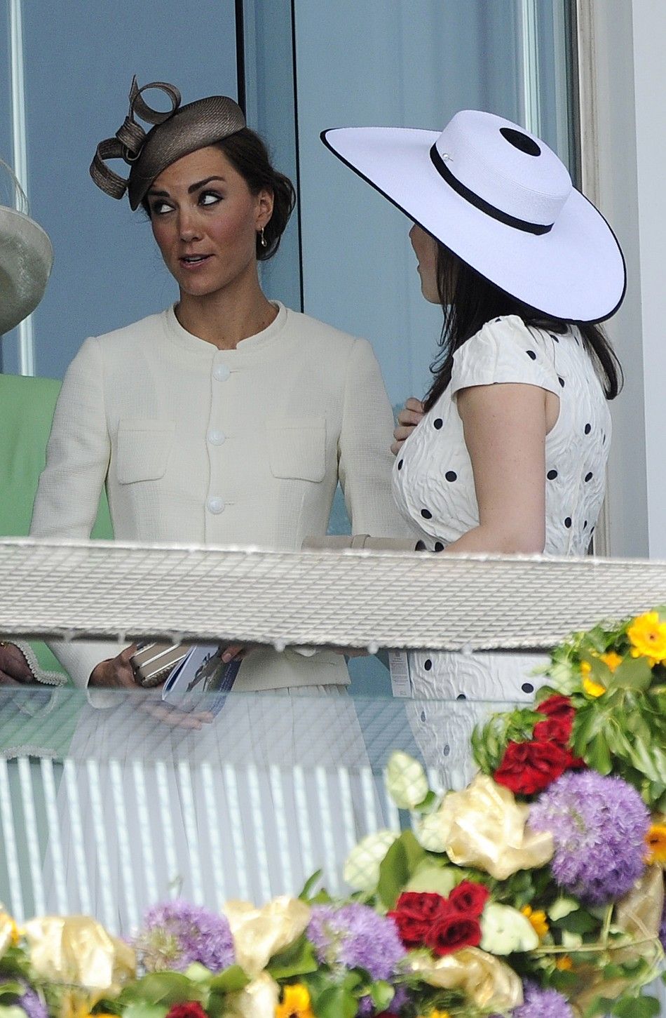 Catherine, Britains Duchess of Cambridge, stands with Britain039s Princess Eugenie as they attend Epsom Derby horse race at Epsom Racecourse in southern England